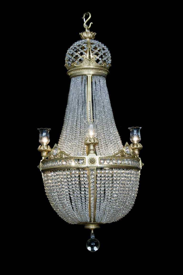 A fine gilt-bronze and cut crystal tent and basket chandelier attributed to La Compagnie des Cristalleries de Baccarat. 

Paris, circa 1890.

Baccarat is the world's leading manufacturer of crystalware. Founded in 1764 under the patronage of