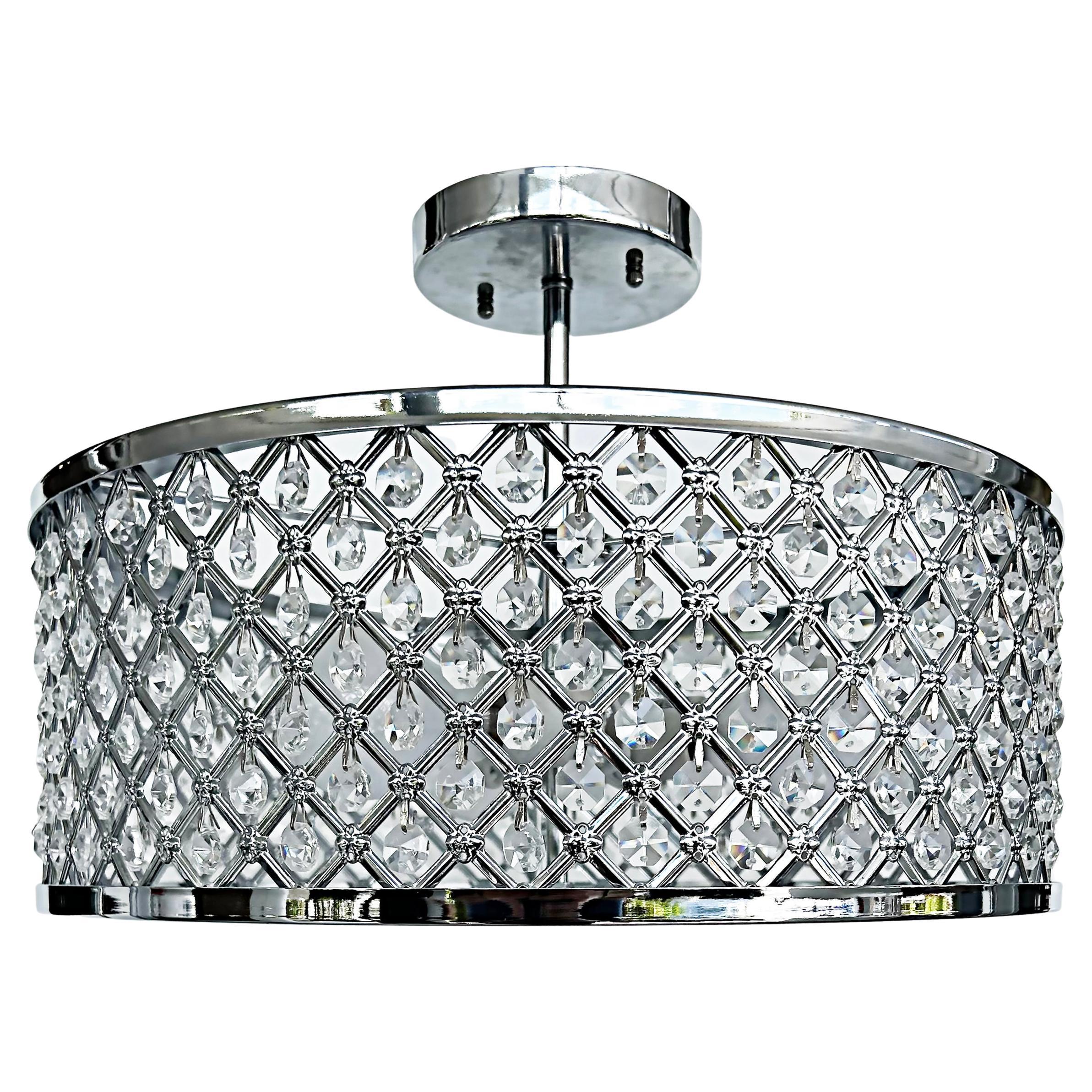 Cut glass and chrome flush mount ceiling light fixture, one available

Offered for sale individually is a round modern chrome flush-mount fixture that has a lattice grid pattern body with suspended crystals within. The light accommodates 3 standard
