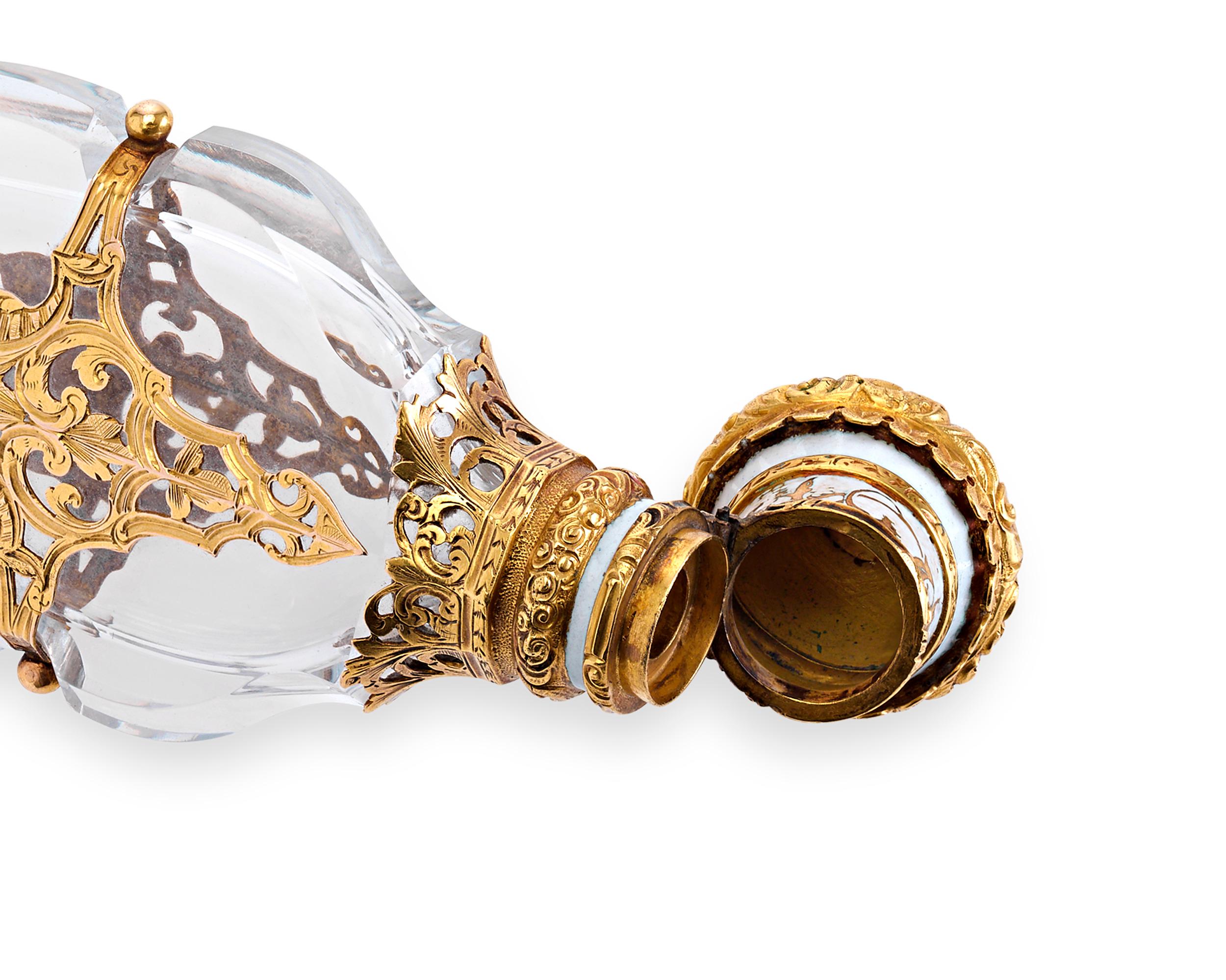 Remarkable artistry and craftsmanship distinguish this enchanting perfume. Displaying a glorious figural shape, this stunning glass vial is wrapped within a frame of yellow gold. The design of this rare piece exhibits an exuberant Napoleon III