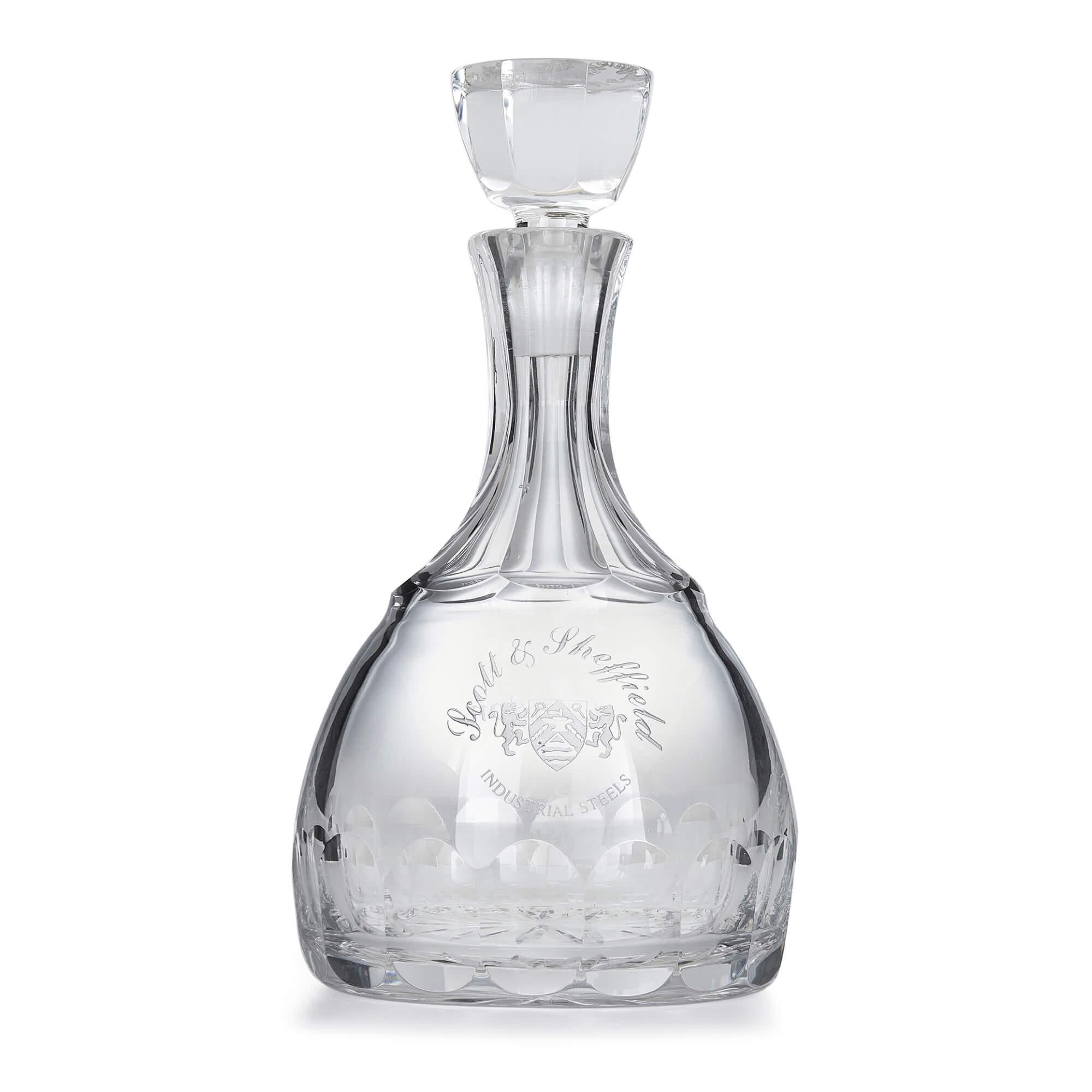 Cut glass and silver sherry decanter by Roberts & Belk
English, 1981
Measures: Height 25cm, diameter 13cm

This fine decanter features a traditionally shaped cut glass body topped with a cut glass stopper. The neck of the decanter is draped with