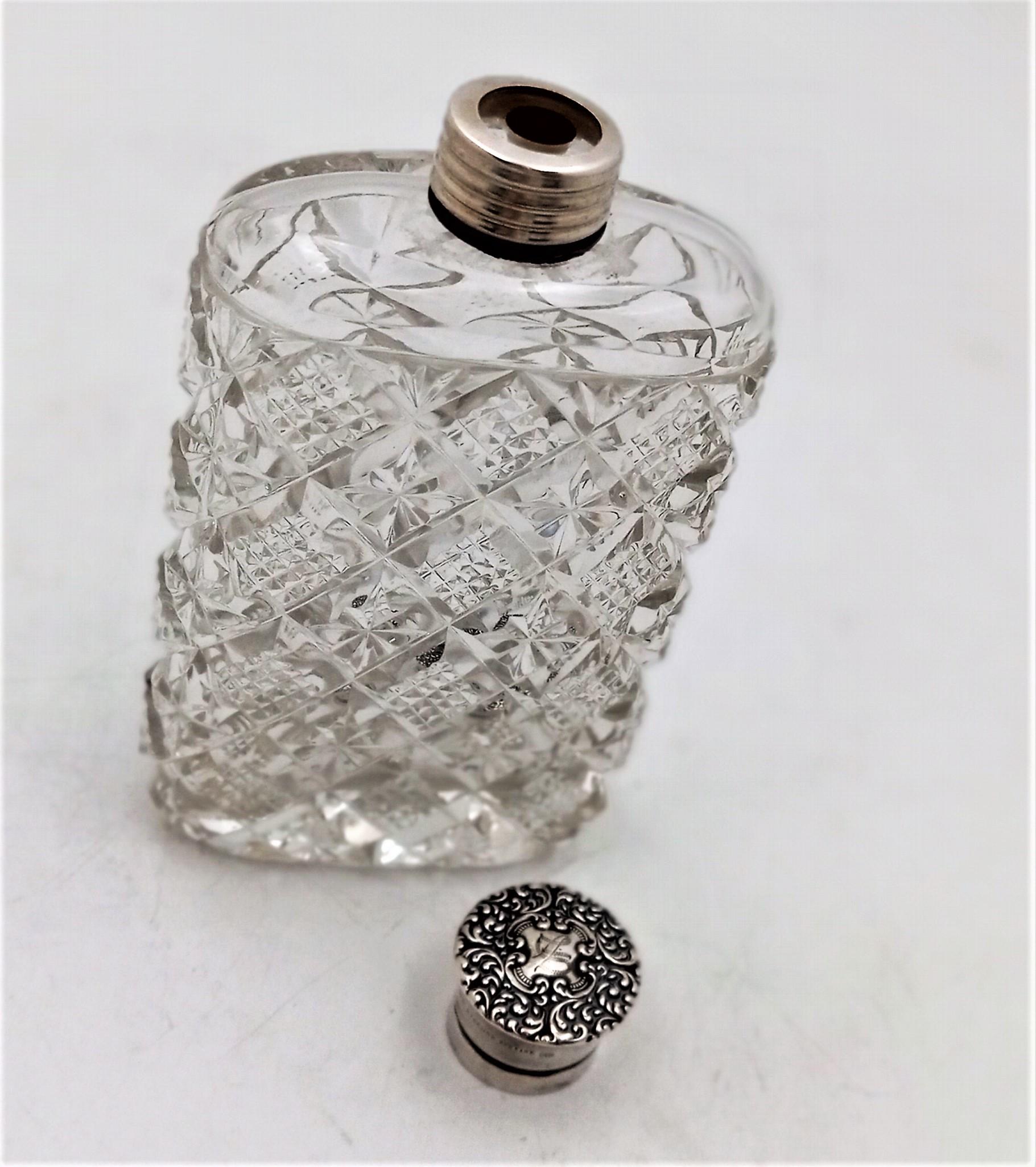 Cut glass Blackinton flask with sterling silver cap, circa 1920s. This elegant piece stands 5 1/2