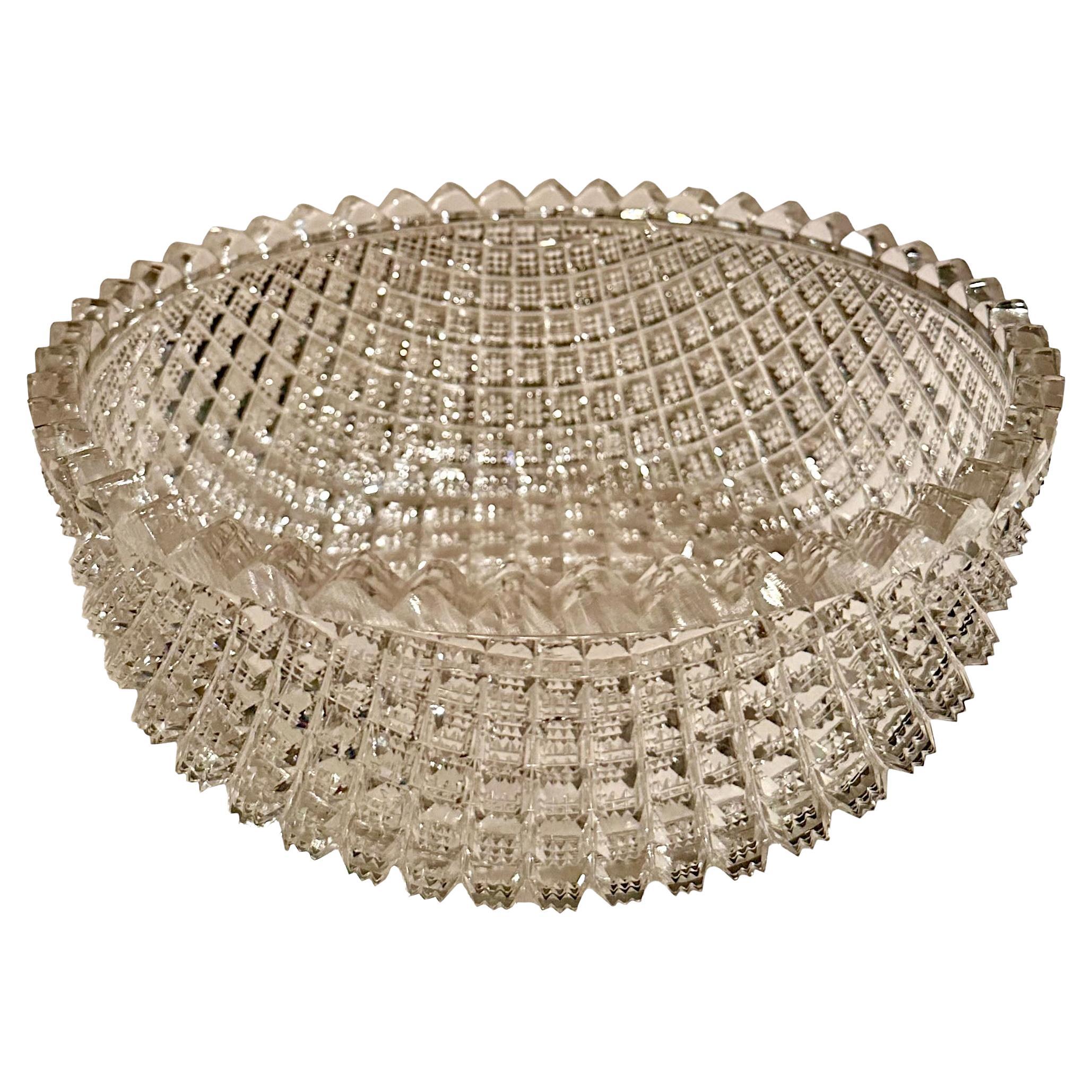 American turn of the century brilliant period cut glass bowl. It is heavily cut and carved and very faceted in a draped pattern.