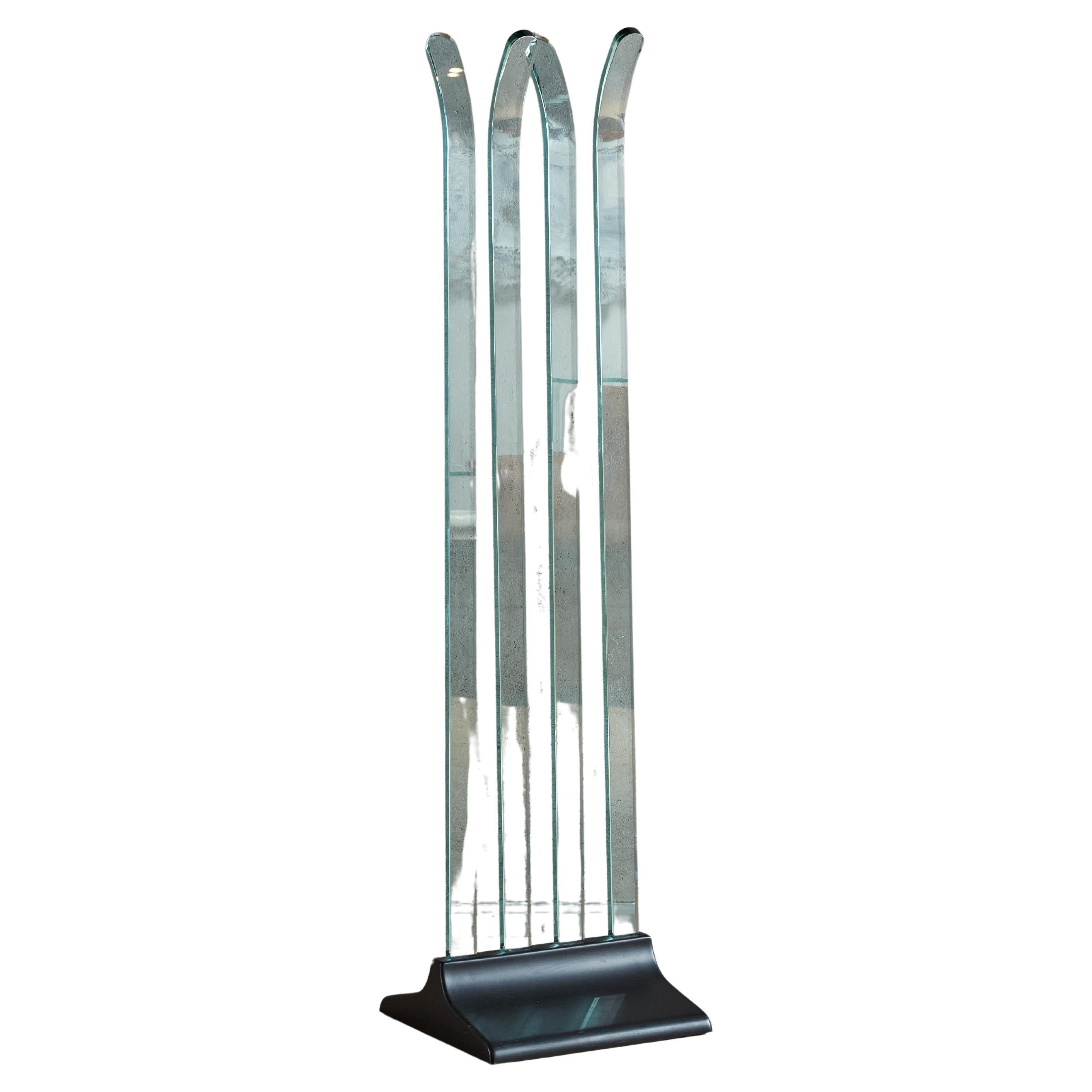 A rare Postmodern cut glass coat hanger designed by Italian glassmaker FIAM in the 1970s. This sculptural piece is composed of gorgeous aqua hued glass sheets that curve in opposing directions near the top, perfect for hanging coats or accessories.