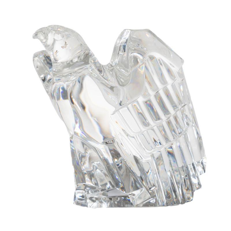 Cut glass eagle by Donald Pollard for Steuben. Described as an eagle poised for flight, a symbol of swift action and potential.
Etched in the glass on the under foot: 