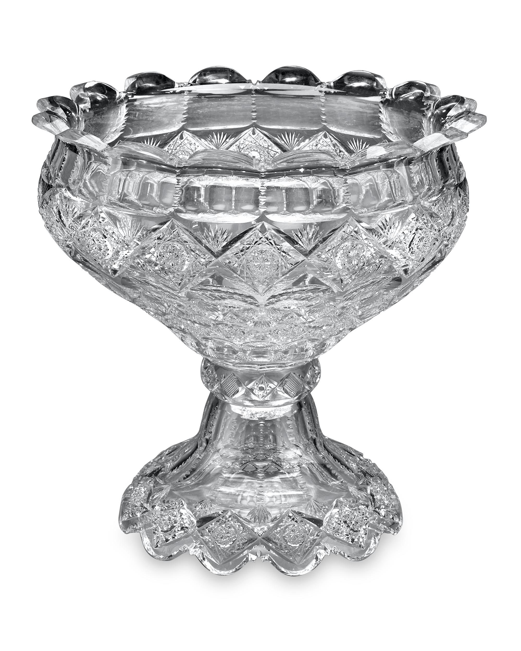 This remarkable cut glass punch bowl by Sinclaire is cut in the rare Brussels pattern. This absolutely stunning pattern is one of the company's scarcest, and this remarkable bowl stands among Sinclaire's finest works. A field of twinkling hobstars