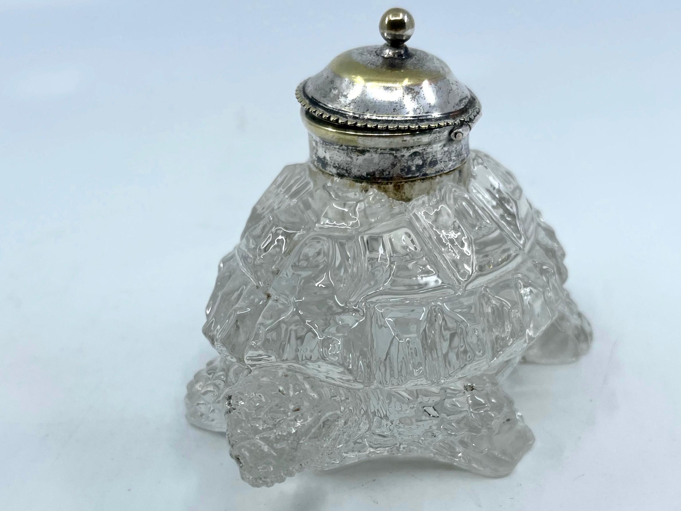 Cut glass tortoise inkwell. Vintage turtle pillbox inkwell of cut glass carrying a mounted finial topped circular lidded well originally for ink but charming as a unique bedside tabletop pillbox. Some antique and smoothed out losses to two feet.