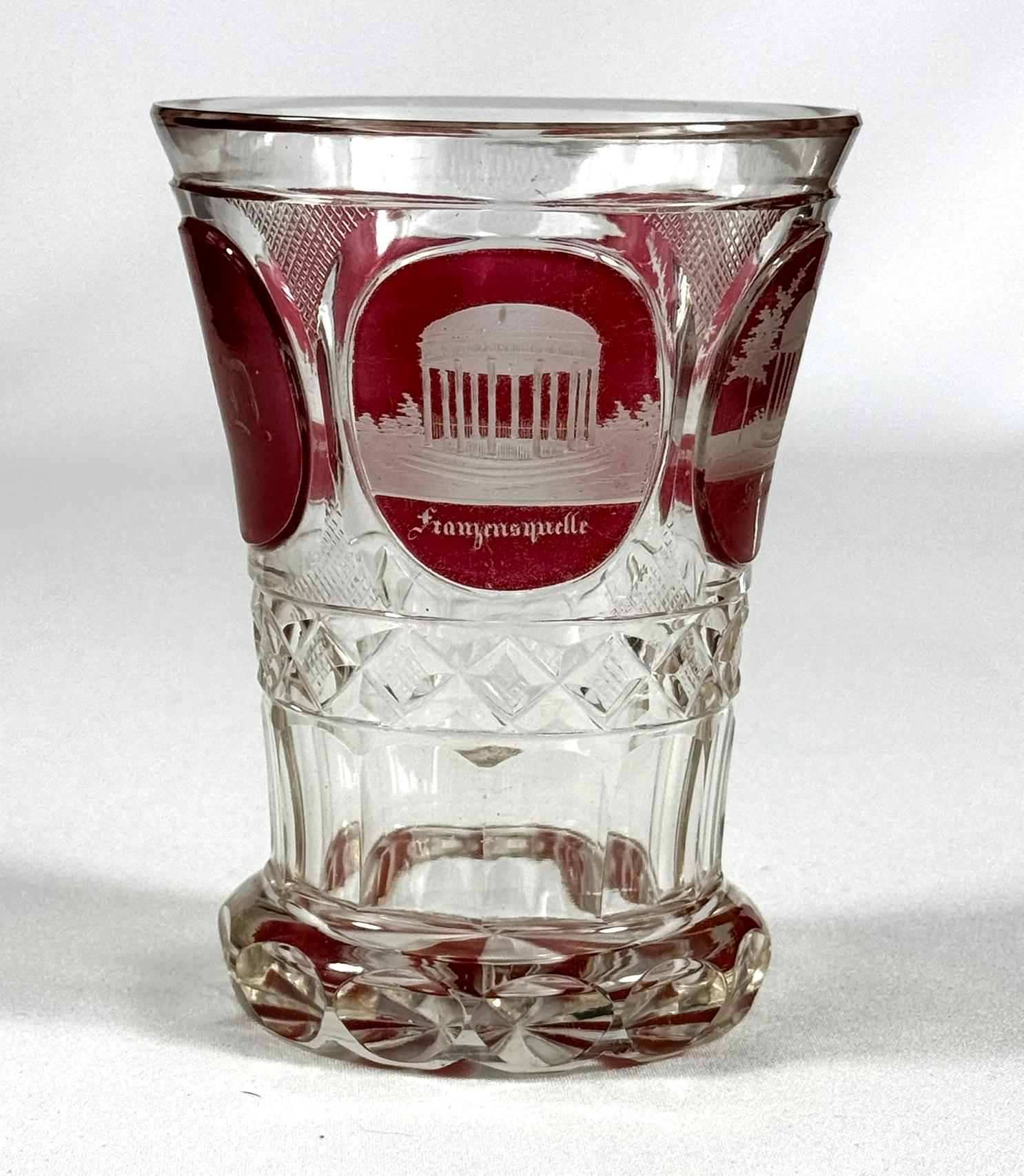 Nice glasses from the 19th century. The glasses is cut with medallions with red lazure. The medallions contain engravings of gazebos around Františkovy Lázně in the West Bohemian region. Františkovy Lázně was inscribed on the UNESCO World Heritage