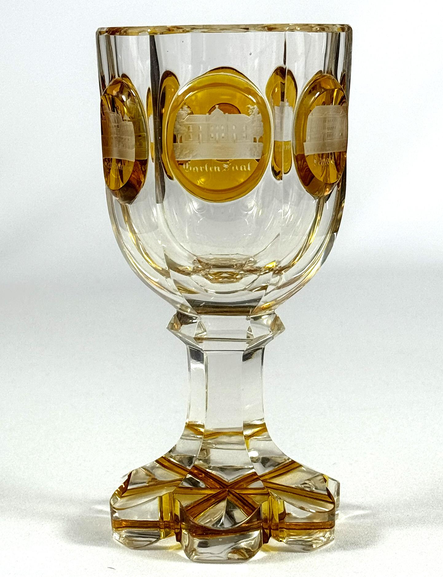 Beautiful goblet from the 19th century with an engraving of Teplice architecture. The goblet is cut, the medallions are painted with yellow lazure and then there is an engraved architecture of the Teplice area in North Bohemia. These were