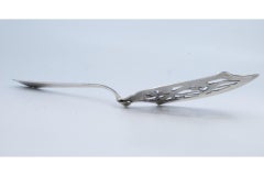 Cut-out silver cake spatula with floral motifs, snake and beaded handle