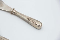 Cut-out silver fish knife and fork