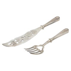 Cut-out silver fish knife and fork