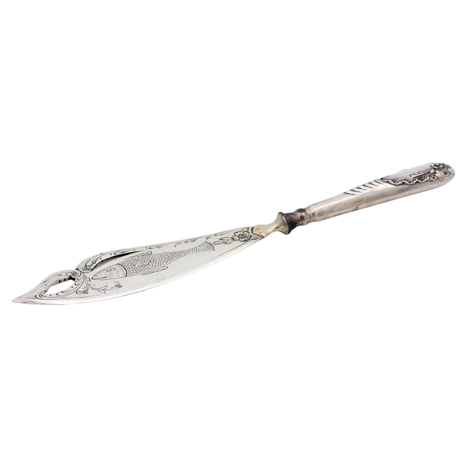 Cut-out silver fish knife
