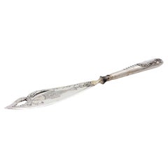Cut-out silver fish knife