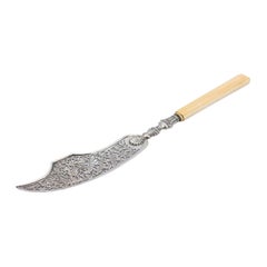 Cut-out silver fish knife with engraving on the blade