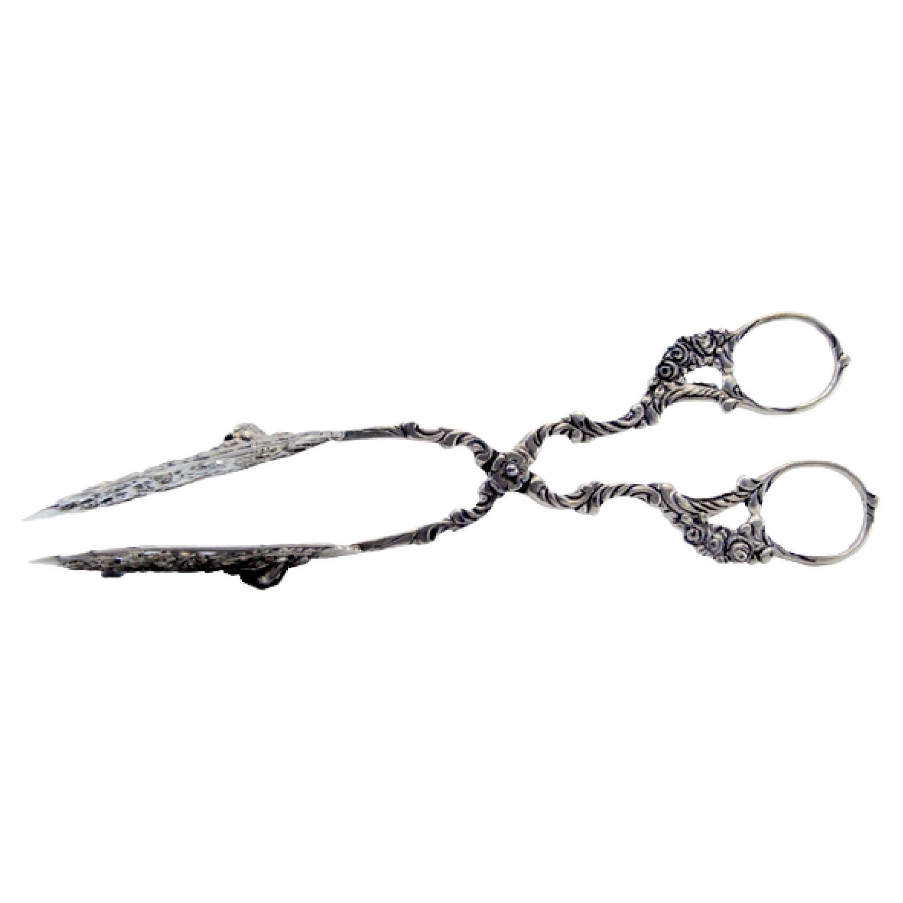 Cut-out silver salad or bread tongs