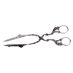 Cut-out silver salad or bread tongs