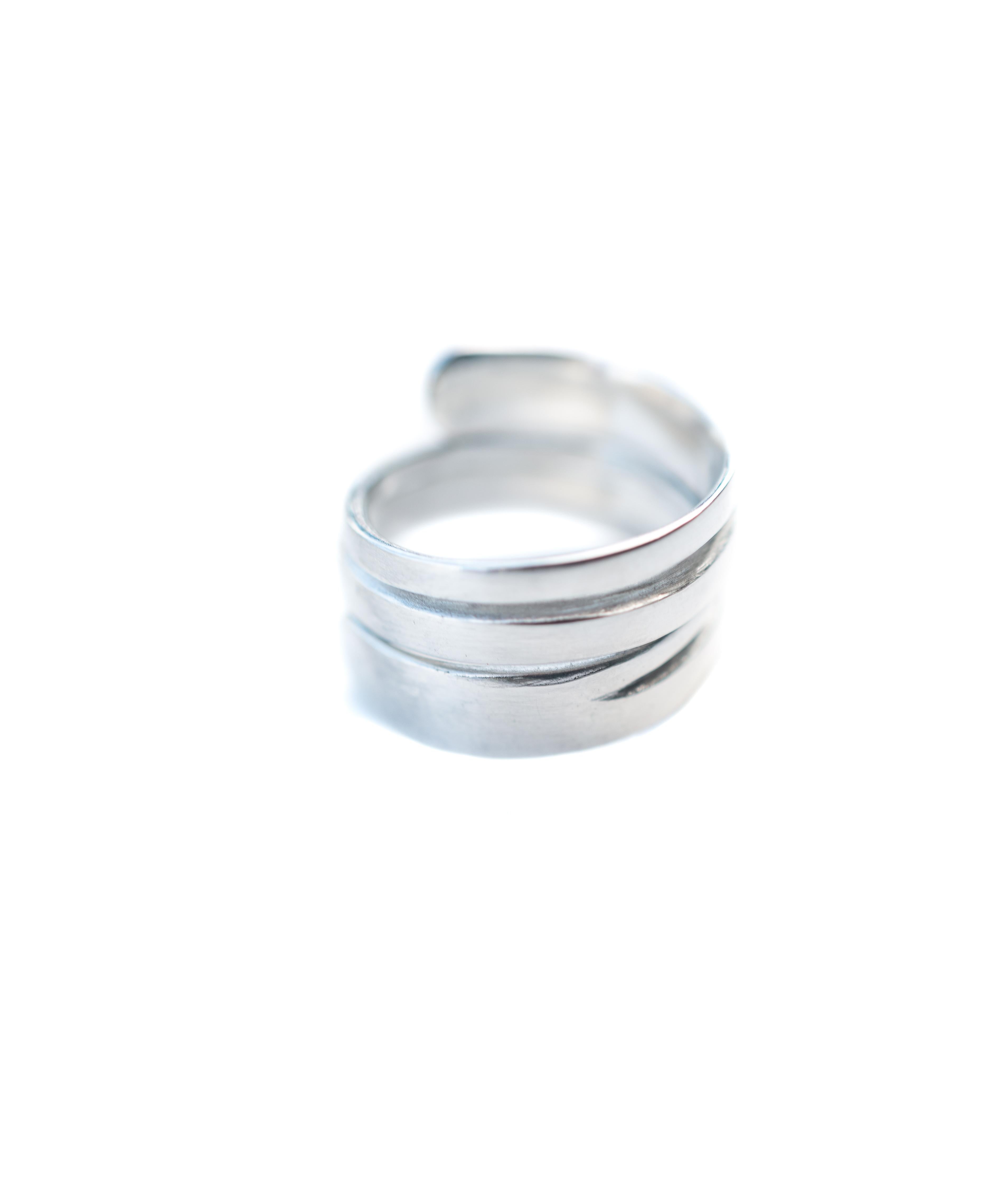 The Atlantic ring is inspired by ocean waves.  The negative spaces featured in the ring are representative of the waves slicing through the ocean surface, creating a cut- out effect.  The Atlantic ring is constructed with sterling silver using the