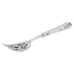 Cut silver fish fork with engraved tines and relief handle