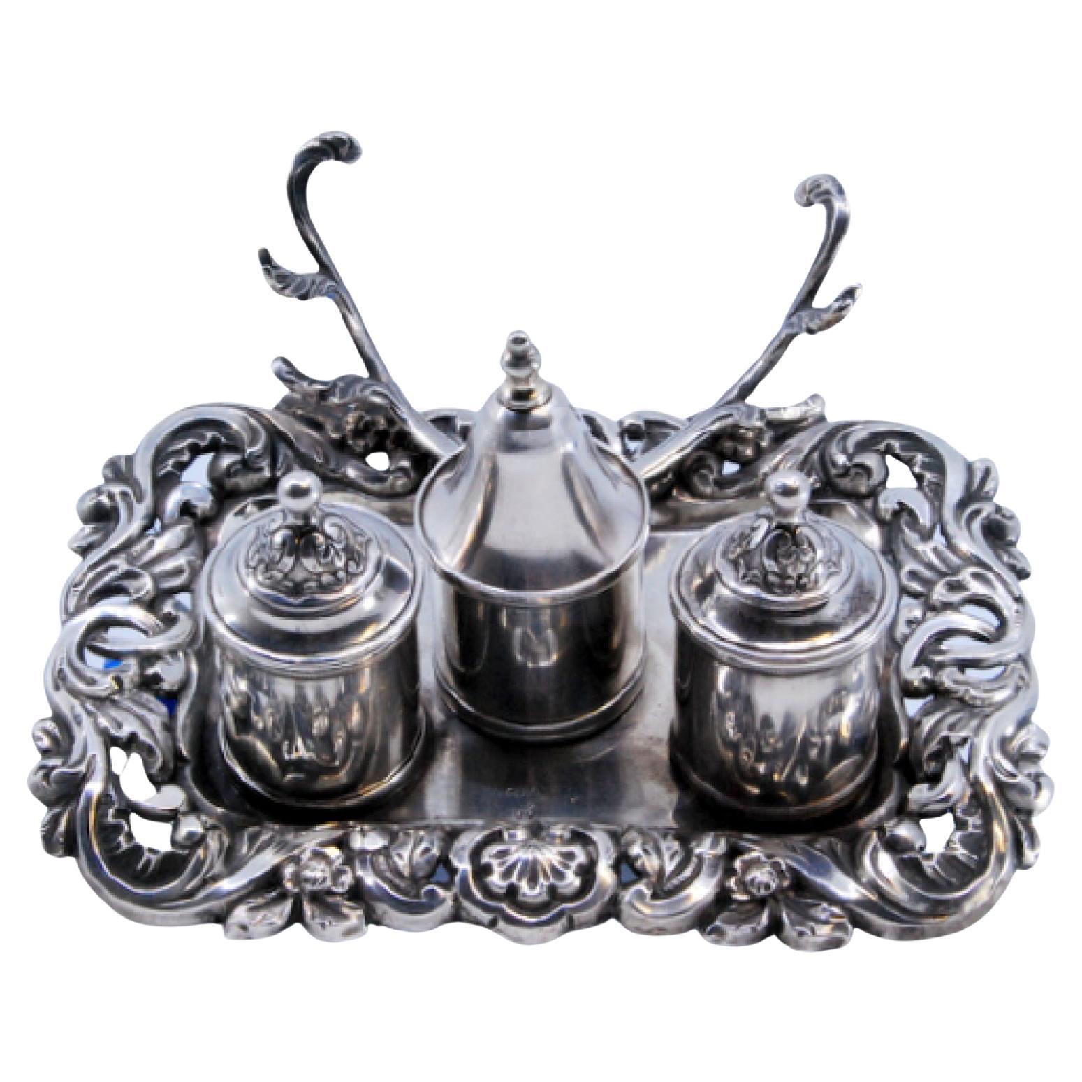 Cut silver inkwell with reliefs, three lidded tanks 
bell For Sale