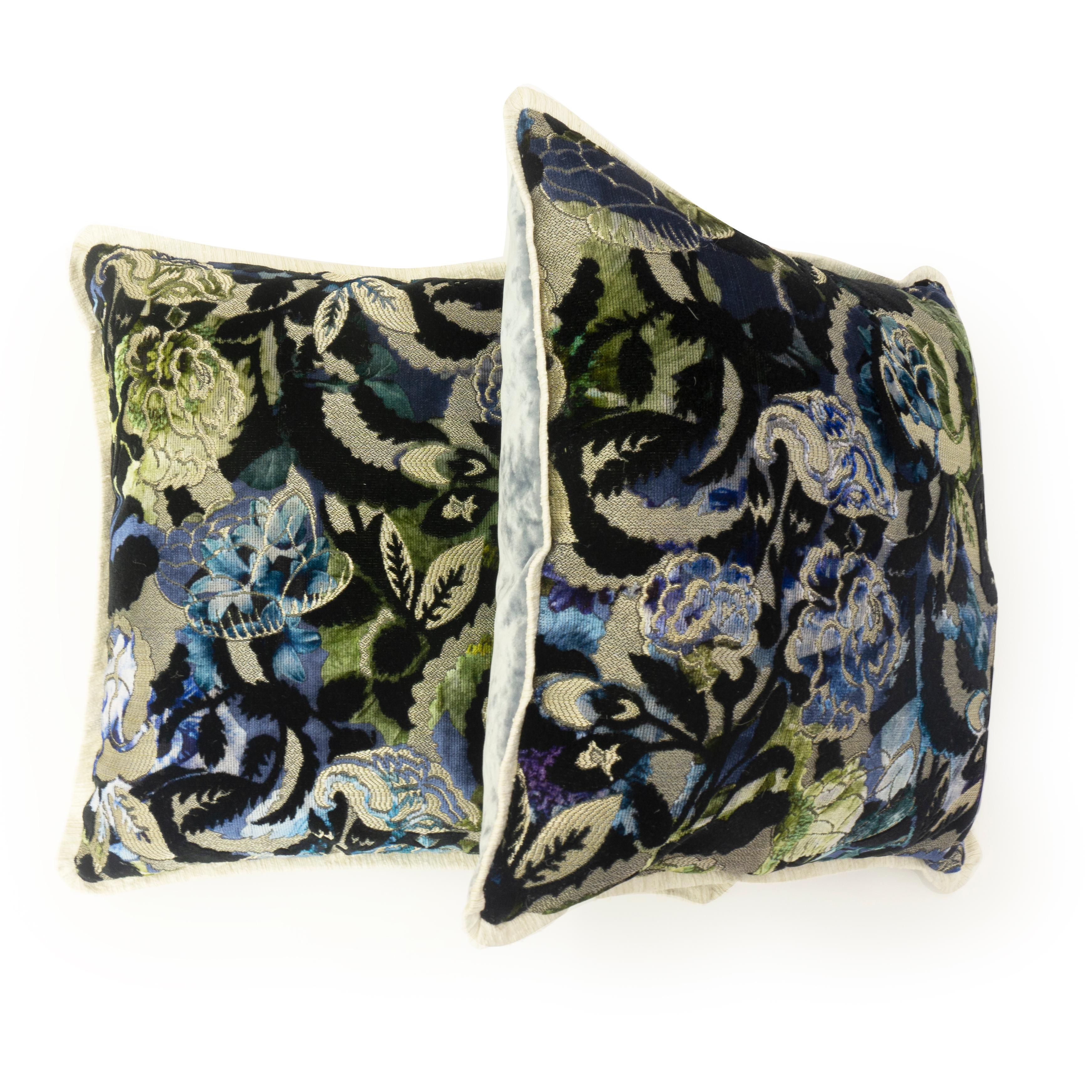 Hand sewn at our studio in Norwalk, Connecticut, these pillows feature a colored cut velvet jacquard floral designer print on the front. The back is sewn in a complimenting light blue velvet and bordered in a cream colored and textured flange.