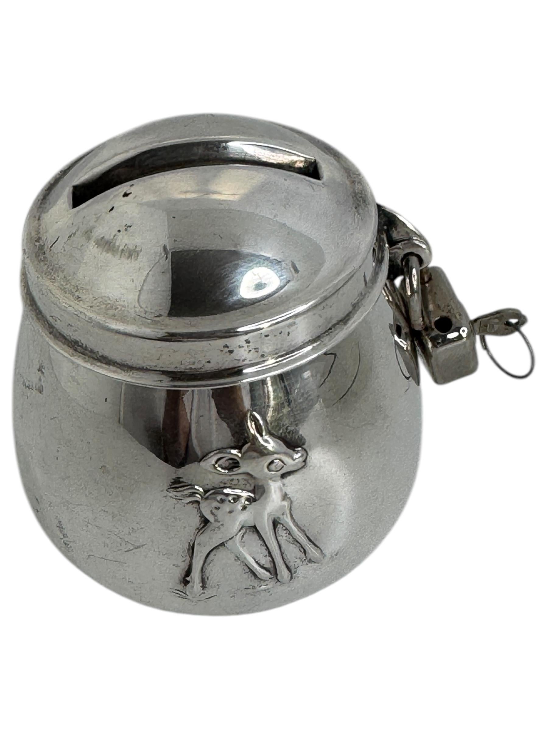 Gorgeous metal silver plate money bank. It's a nice collectible item. Probably a Souvenir from the famous Disney Land. A beautiful decorative item, with nice patina. Made in the 1950s or older and marked like seen in the pictures. It has a key and