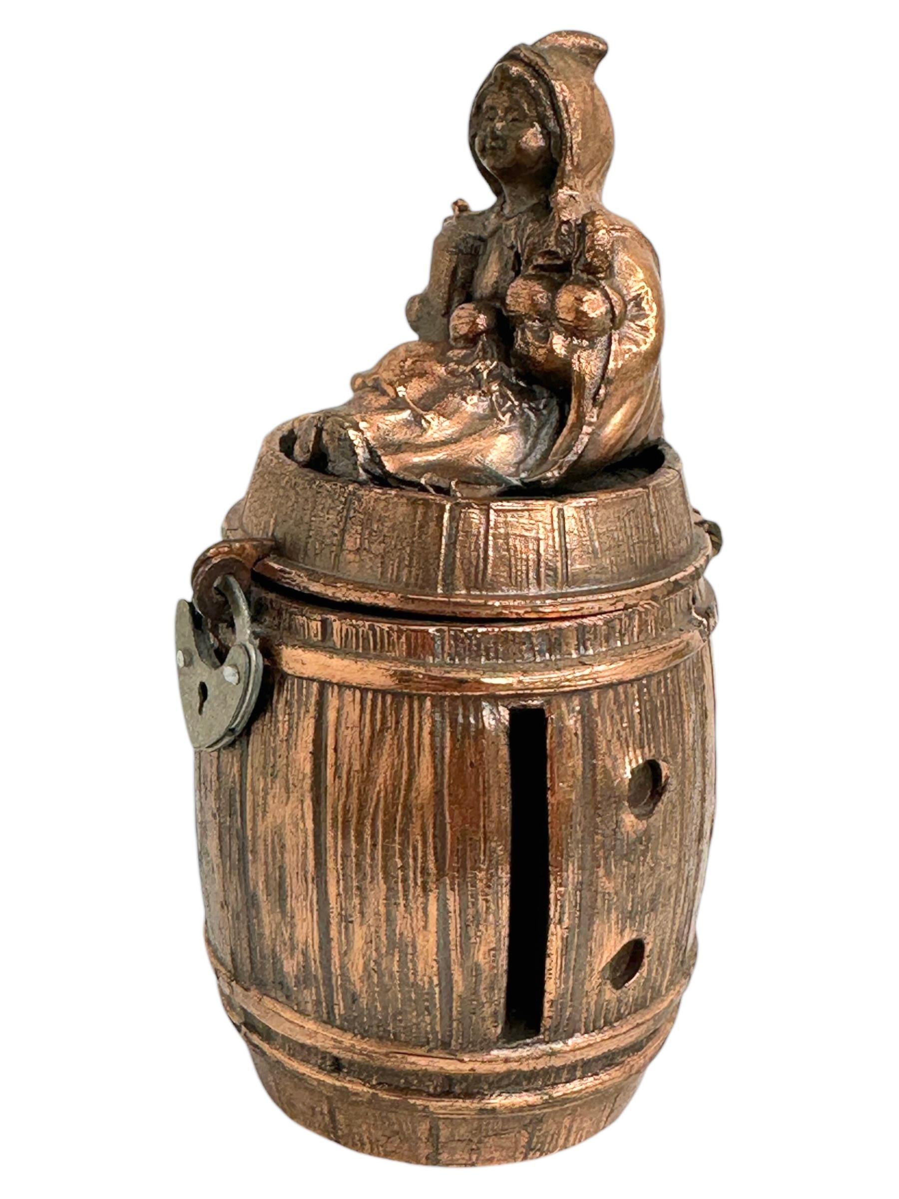 Gorgeous antique Souvenir metal money bank. It's a beer barrel with the Munich Child on top. Probably a Souvenir from the famous Octoberfest held in Munich every year. A beautiful decorative item, with nice patina. Made in Germany, circa 1920s or