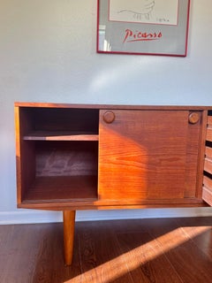 Cute petite mid century modern teak sideboard with round pulls, circa 1960s