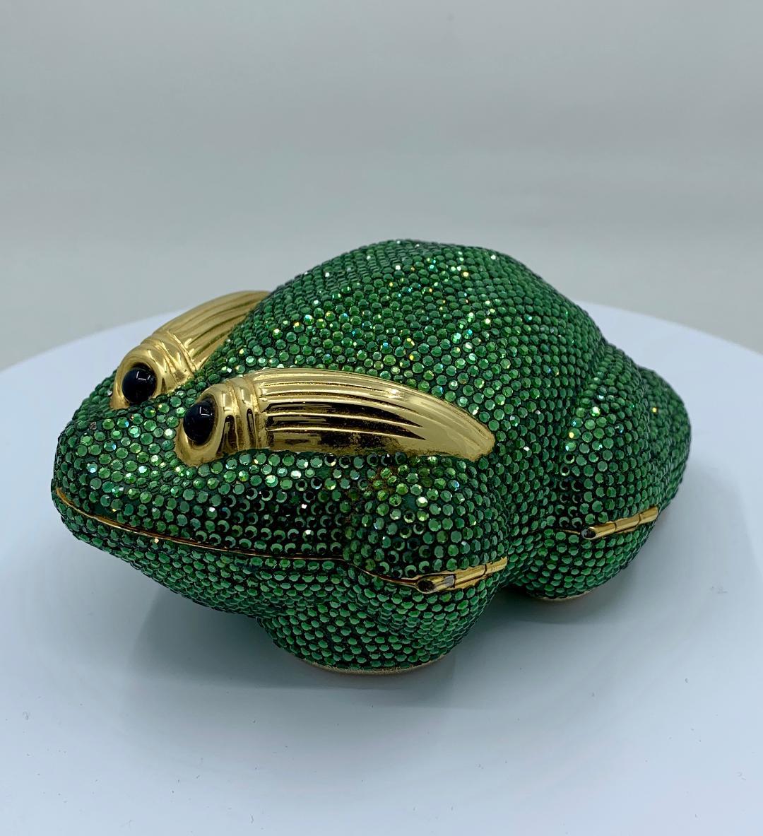 Fabulous handmade couture designer, Judith Leiber, crystal Frog minaudiere evening bag or evening clutch is completely covered in green crystals. Gold toned metal frame with metallic gold leather lined interior with compartments and a long gold