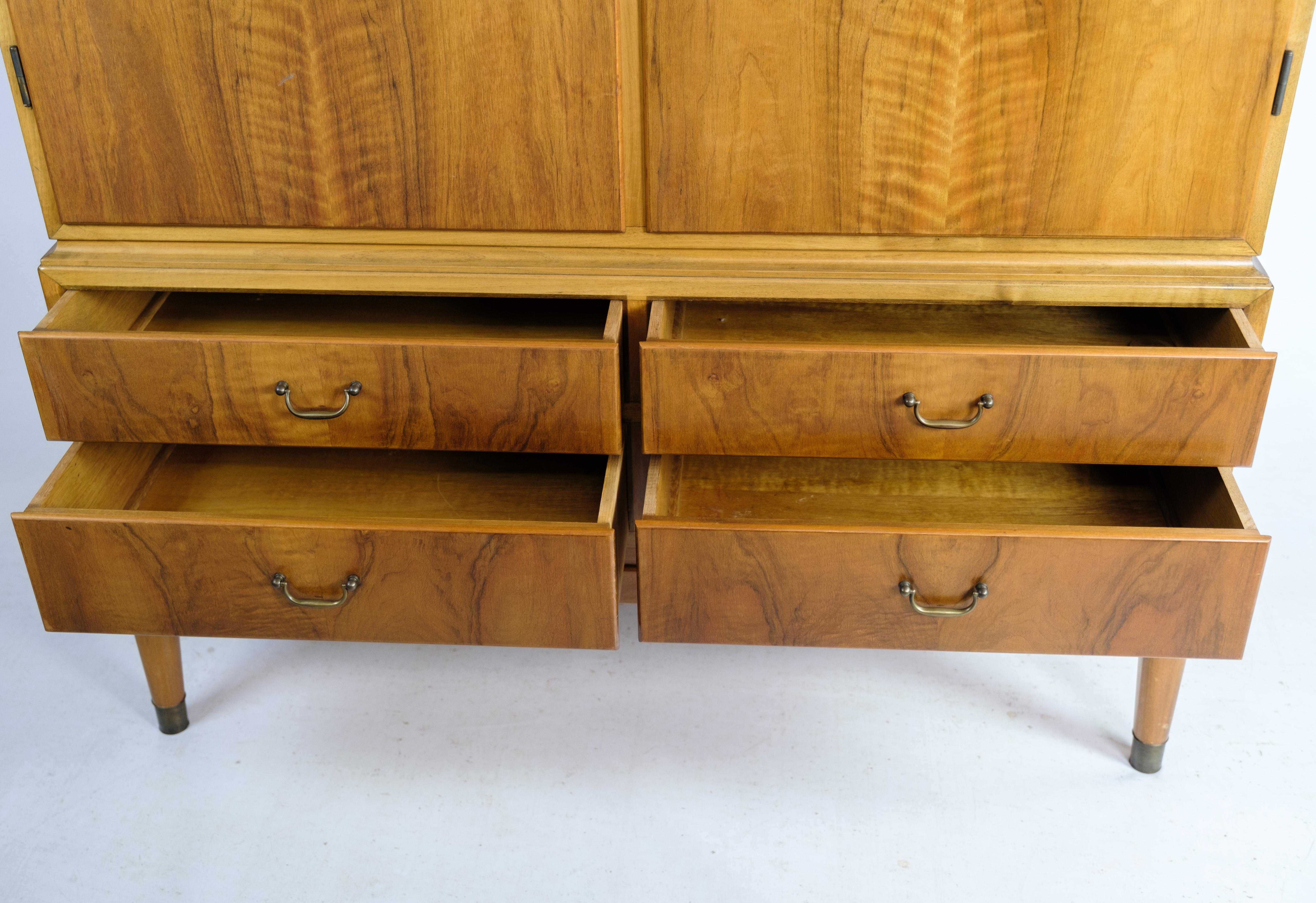 Cutlery cabinet in light walnut by a Danish master carpenter from around the 1940s. The cabinet has 2 doors and 4 drawers. In very good used condition.