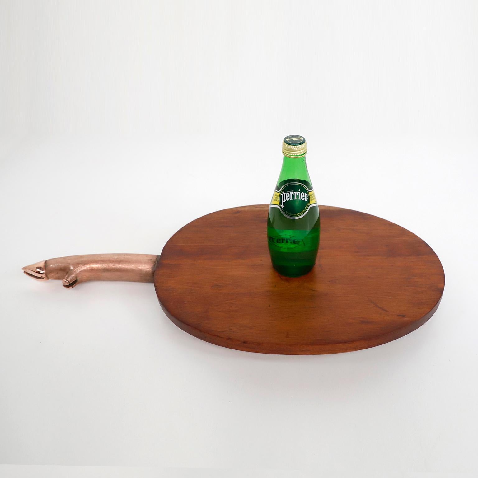 Folk Art Cutting and Presenting Board Made of Wood and Copper Handle in Pig's Foot Form For Sale