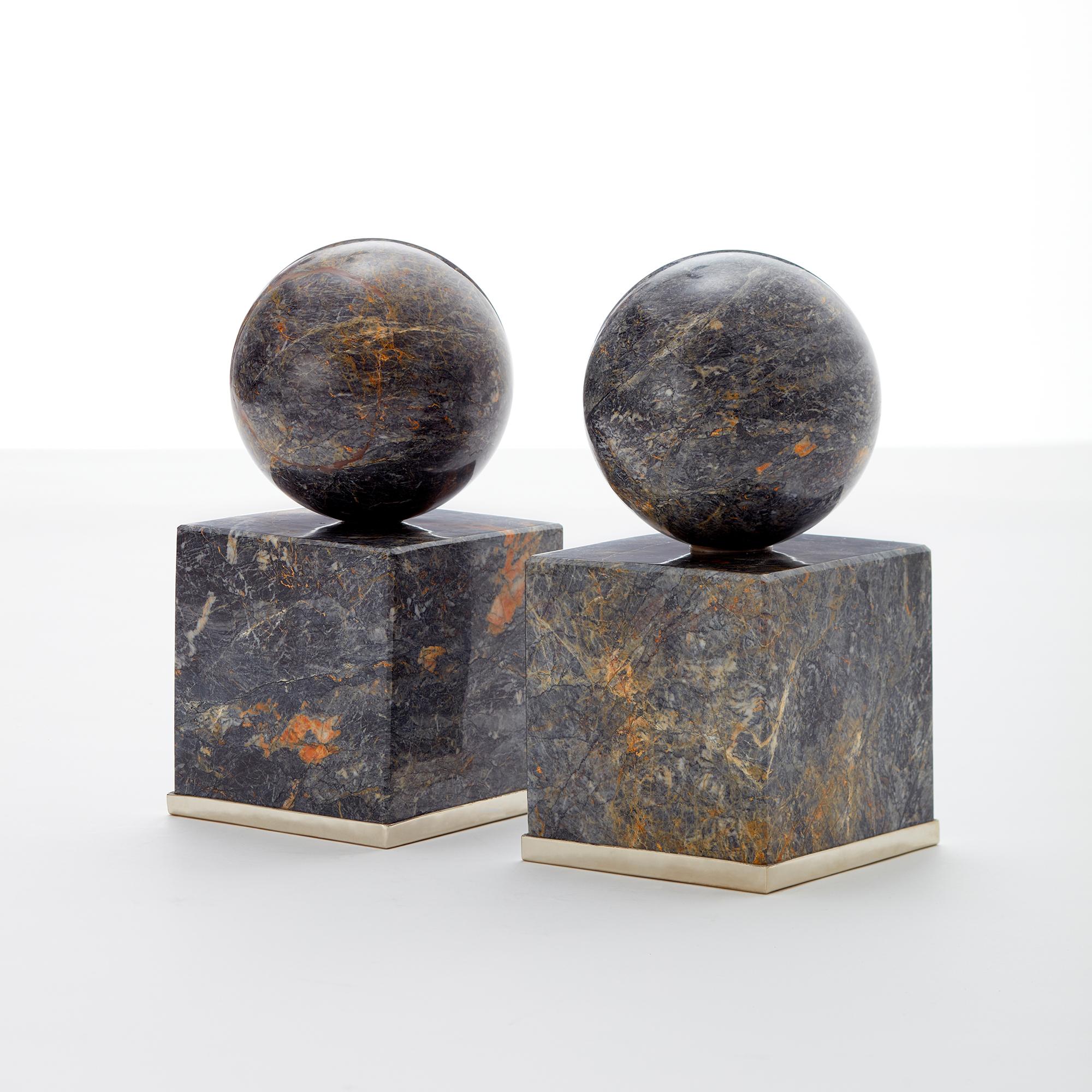 Cuyo bookends are solid heavy beautiful pieces of geometrical onyx stone, mostly in square base and round top. Very sharm for a personal library.

Our pieces are made by hand. One of a kind.
All natural stones may vary in color.