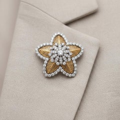 Spilla floreale Cuzy in oro 18 carati, platino e diamanti