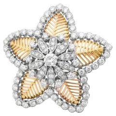 Spilla floreale Cuzy in oro 18 carati, platino e diamanti