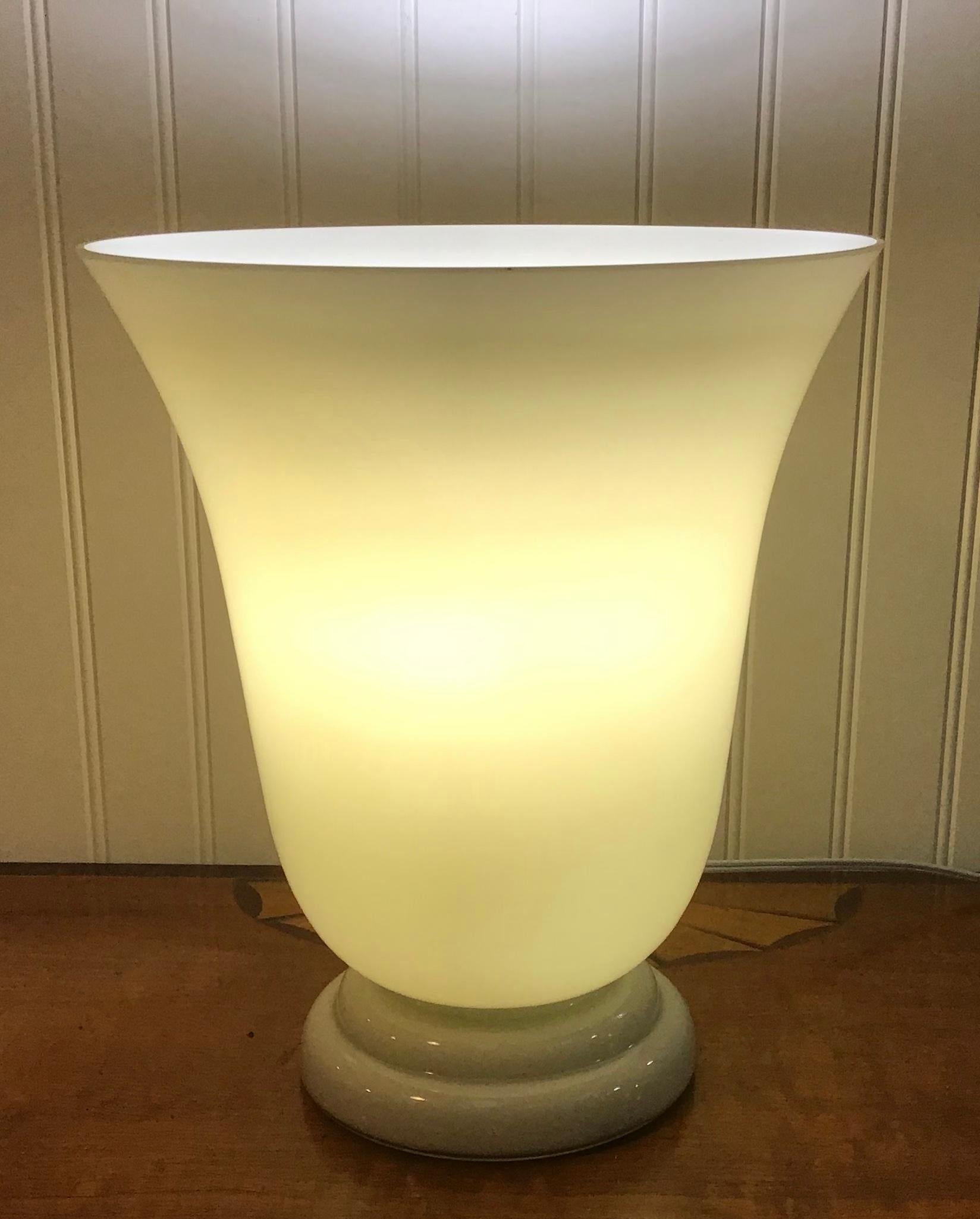 Urn shaped cased glass torchère lamp in the French Art Deco style
cream color exterior with white interior
Measures: 11 3/4 inches high
10 inch wide at top
5 3/4 inch base.