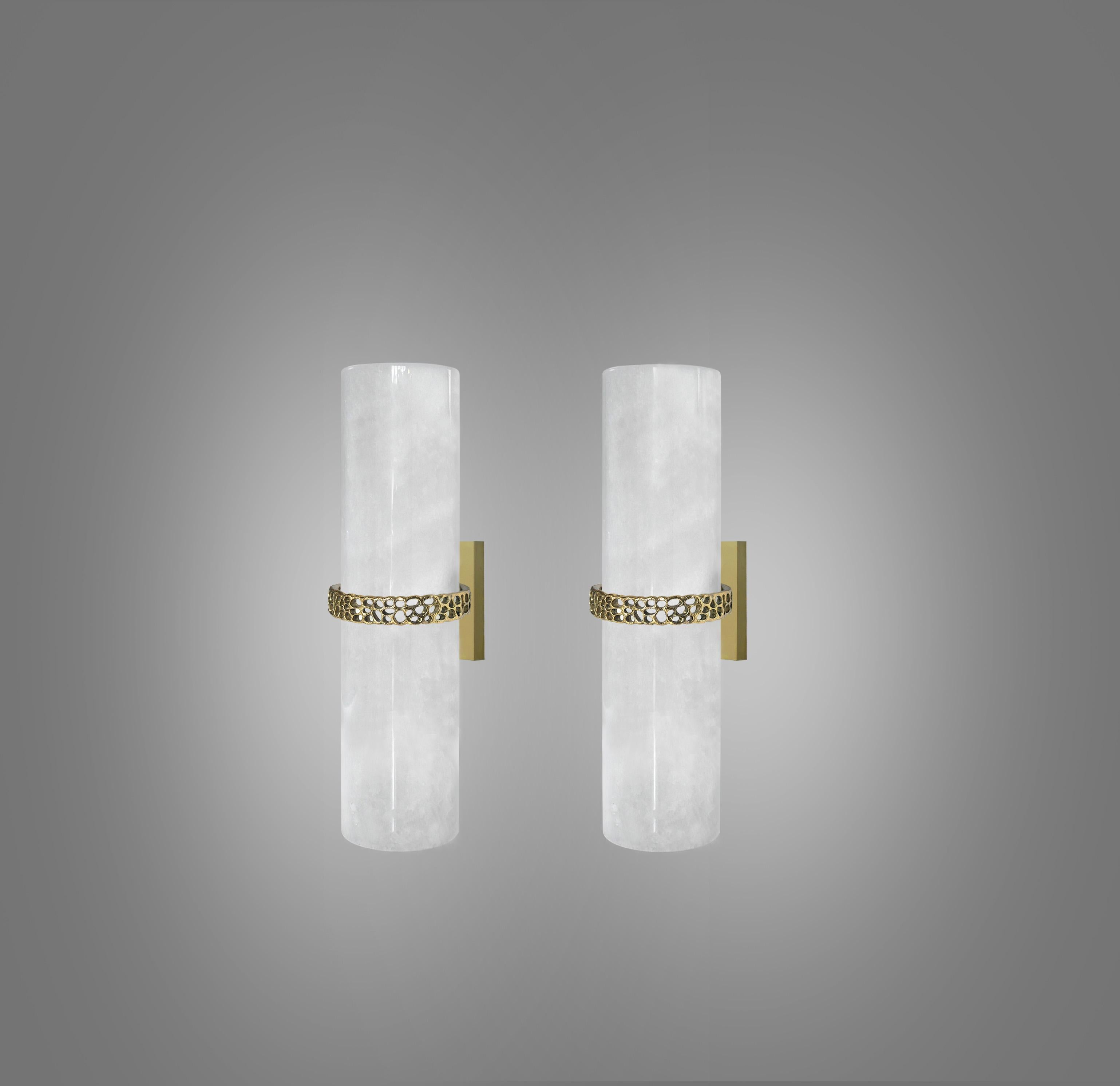 Cylindrical rock crystal sconces with designed hammered brass detail decoration. Created Phoenix Gallery, NYC.
Each wall sconce is installed with two E26 sockets, 80watts max each socket, a total of 160-watt maximum.
Custom size, quantity, and