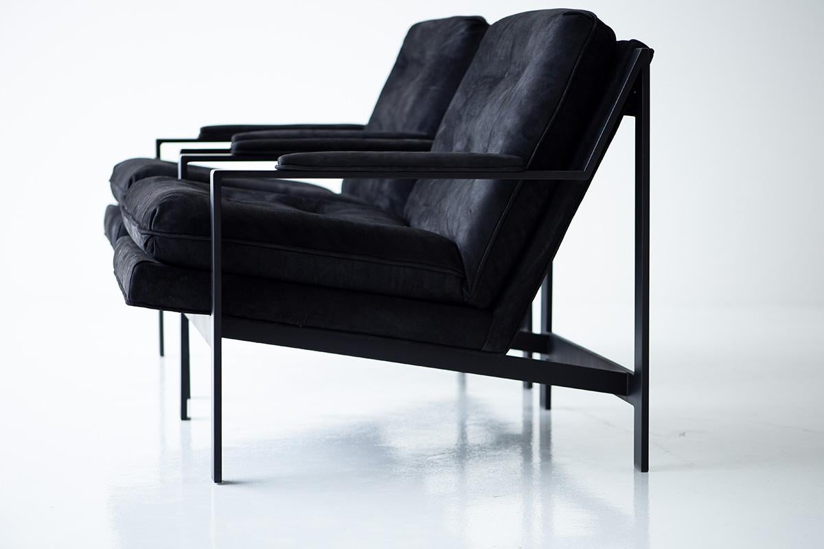 Designer: Cy mann. 

Manufacturer: Unknown
Period/Model: Mid-Century Modern 
Specs: Metal, Leather 

Condition: 

These Cy Mann leather lounge chairs are in excellent condition. The black metal frames are in excellent condition. The chairs
