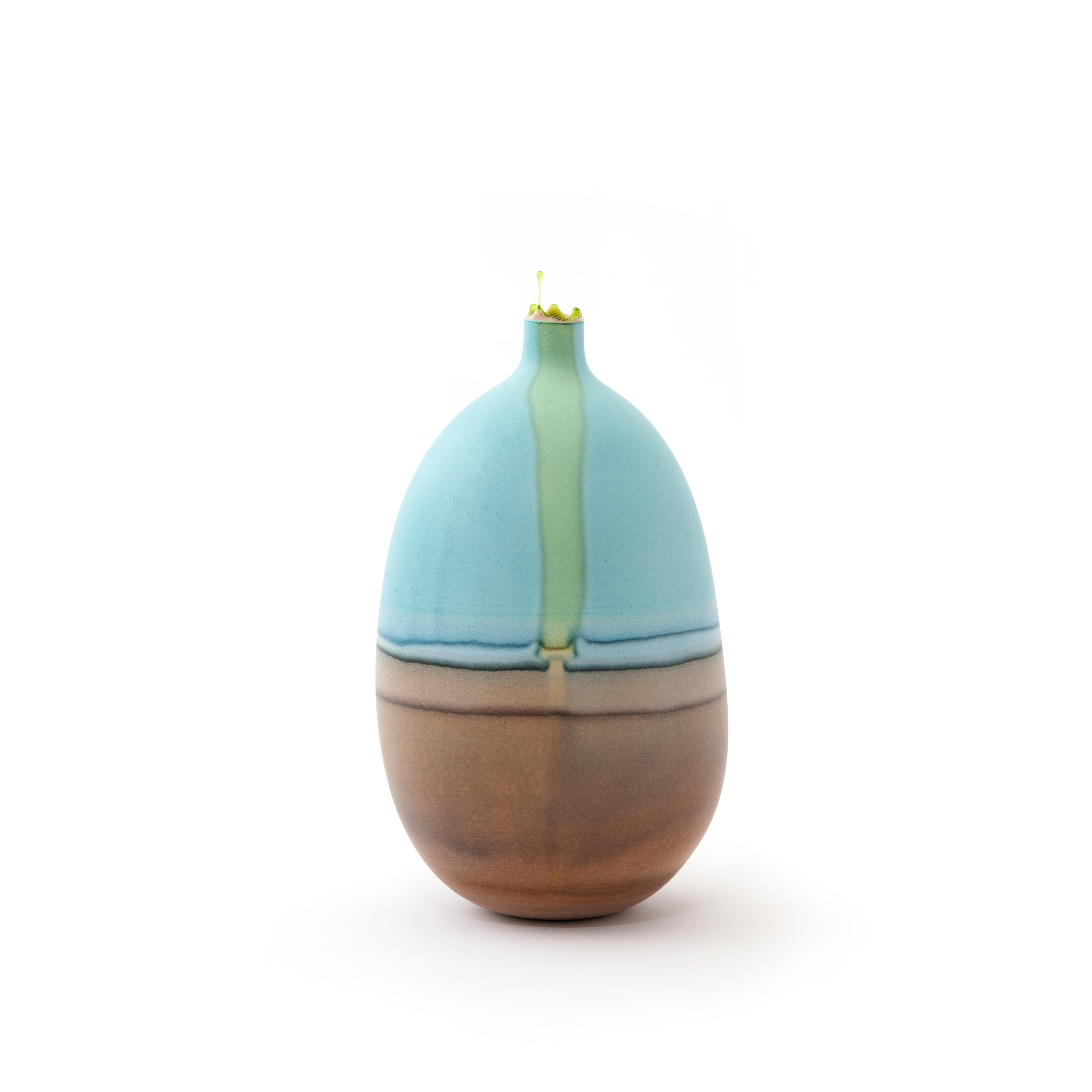 Cyan and umber mercury vase by Elyse Graham
Dimensions: W 14 x D 14 x H 25.5cm
Materials: Plaster, Resin
MOLDED, DYED, AND FINISHED BY HAND IN LA. CUSTOMIZATION
AVAILABLE.
ALL PIECES ARE MADE TO ORDER

This collection of vessels is inspired