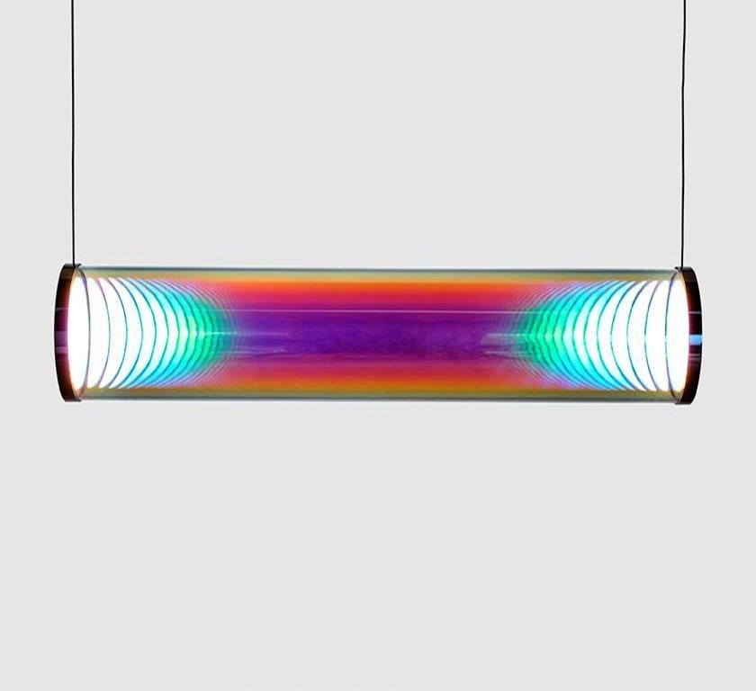 Cyan-magenta Iris tube by Sebastian Scherer
Material: crystal glass, mirror stainless steel
Dimensions: L 70 cm x Ø 12 cm
Also available in mirror brass
Colour: Cyan-magenta
Also available in gold-indigo, blue-orange, pink-green,