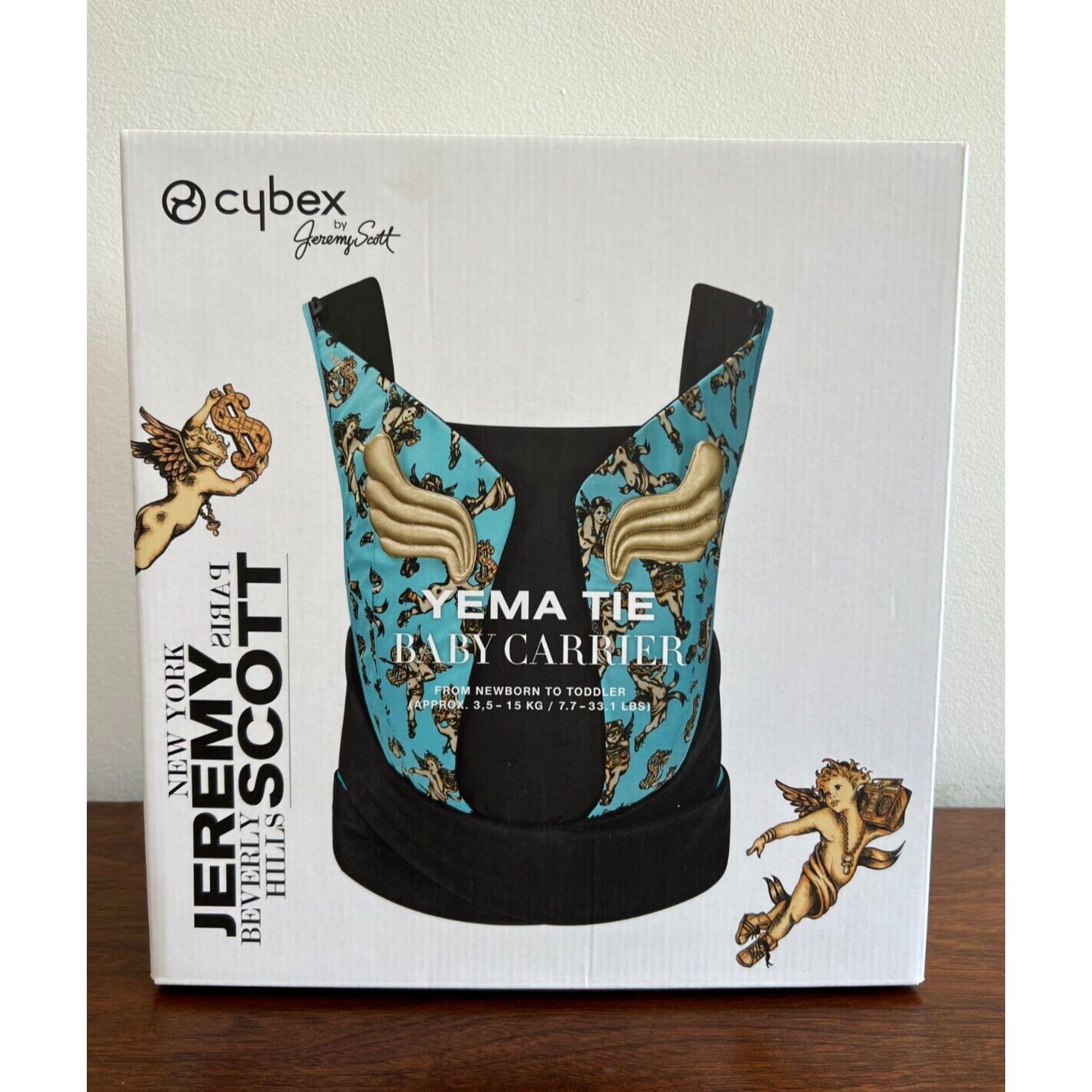 Cybex x Jeremy Scott Yema Tie Baby Carrier Blue and Gold by Cherubs Wings Angel

Additional Information:
Color: Blue, Gold, Black
Pattern: Wings, Angels
Condition: Brand new, original double boxed, never removed from box