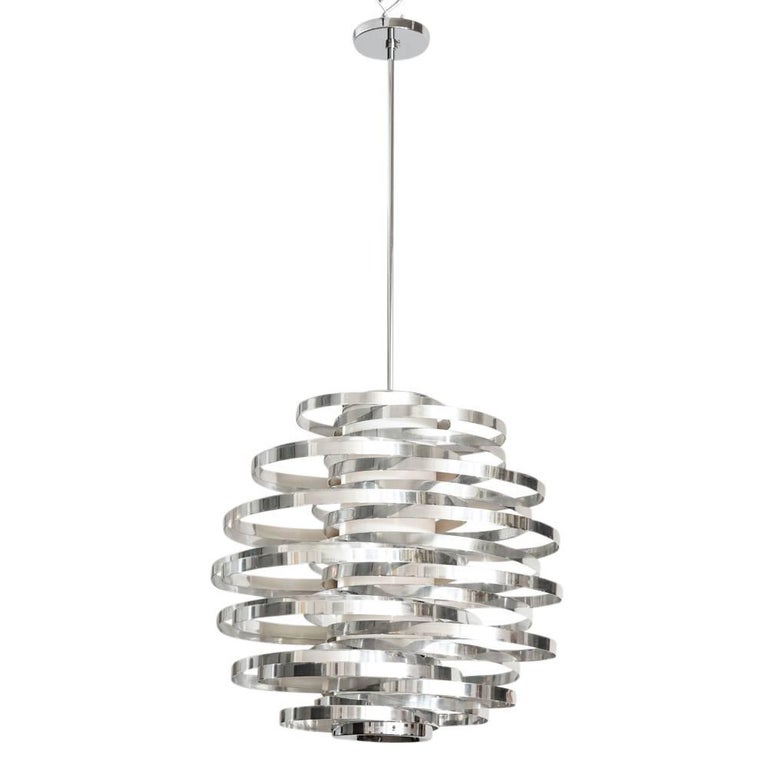 Cyclone chandelier, aluminum, metallic chrome bands. Constructed of polished aluminum bands and a plastic cylinder diffuser. The body of the fixture measures: 23