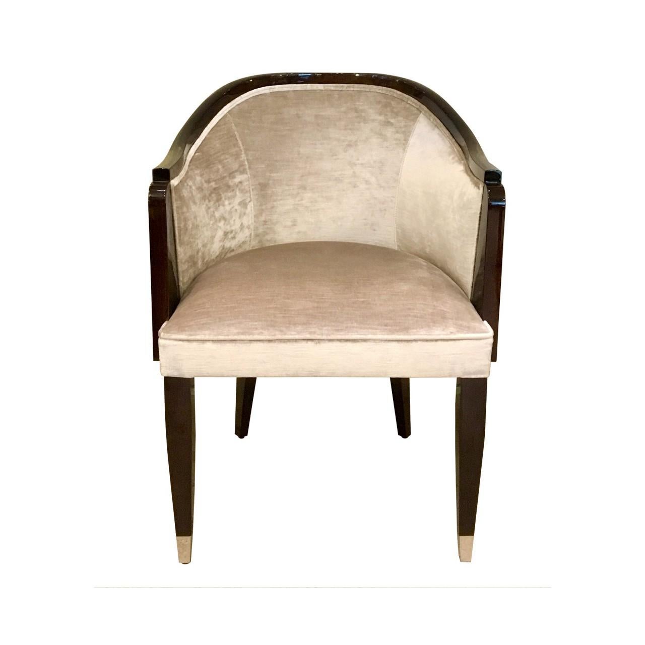 An early Art Deco style bergere chair with slightly slopped arms; it beautifully pulls up to dining tables or writing desks. Solid wood frame in warm walnut high gloss finish, upholstered in a soft creamy silver velvet. Nickel Sabots on front