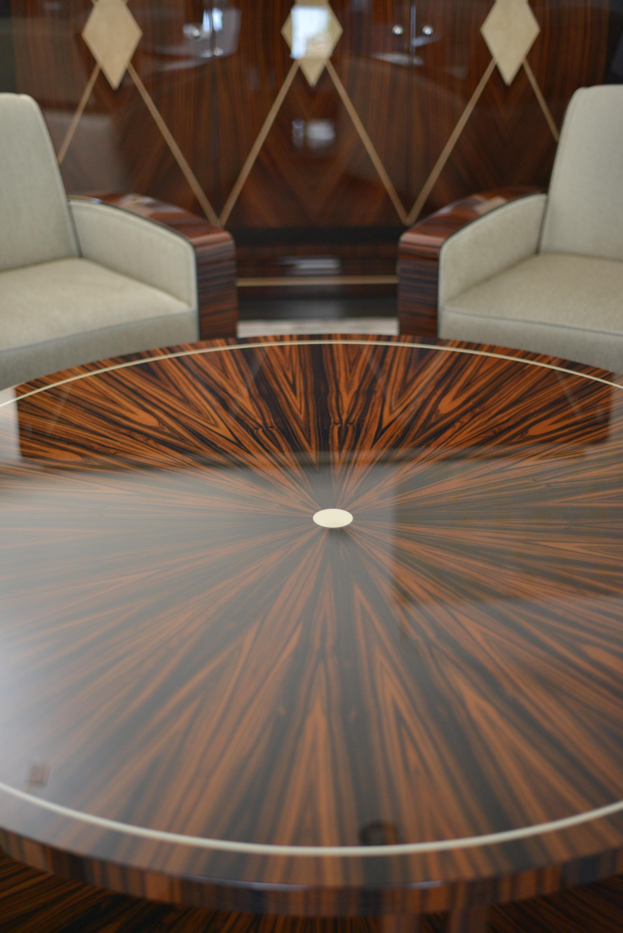 Unusual Art Deco round cocktail table in Macassar starburst with faux ivory inlay. Handcrafted in Germany by Cygal Art Deco. Made upon order, available in custom sizes. 
 