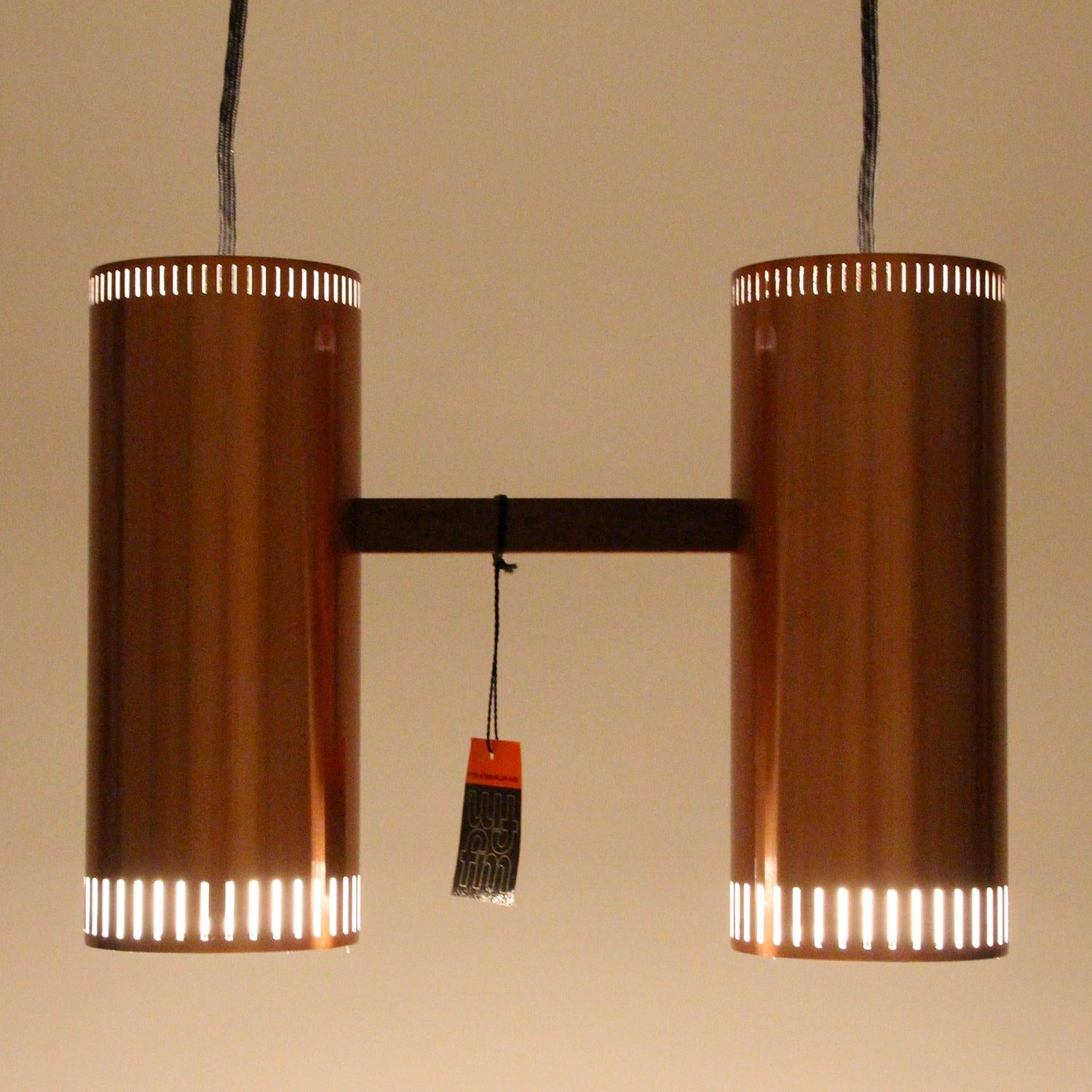 Cylinder II, copper pendant light by Jo Hammerborg in 1966 for Fog & Mørup - Scandinavian modern copper light fixture with two individual pendants in extremely rare mint unused condition!

The Cylinder II is comprised of two identical cylinder