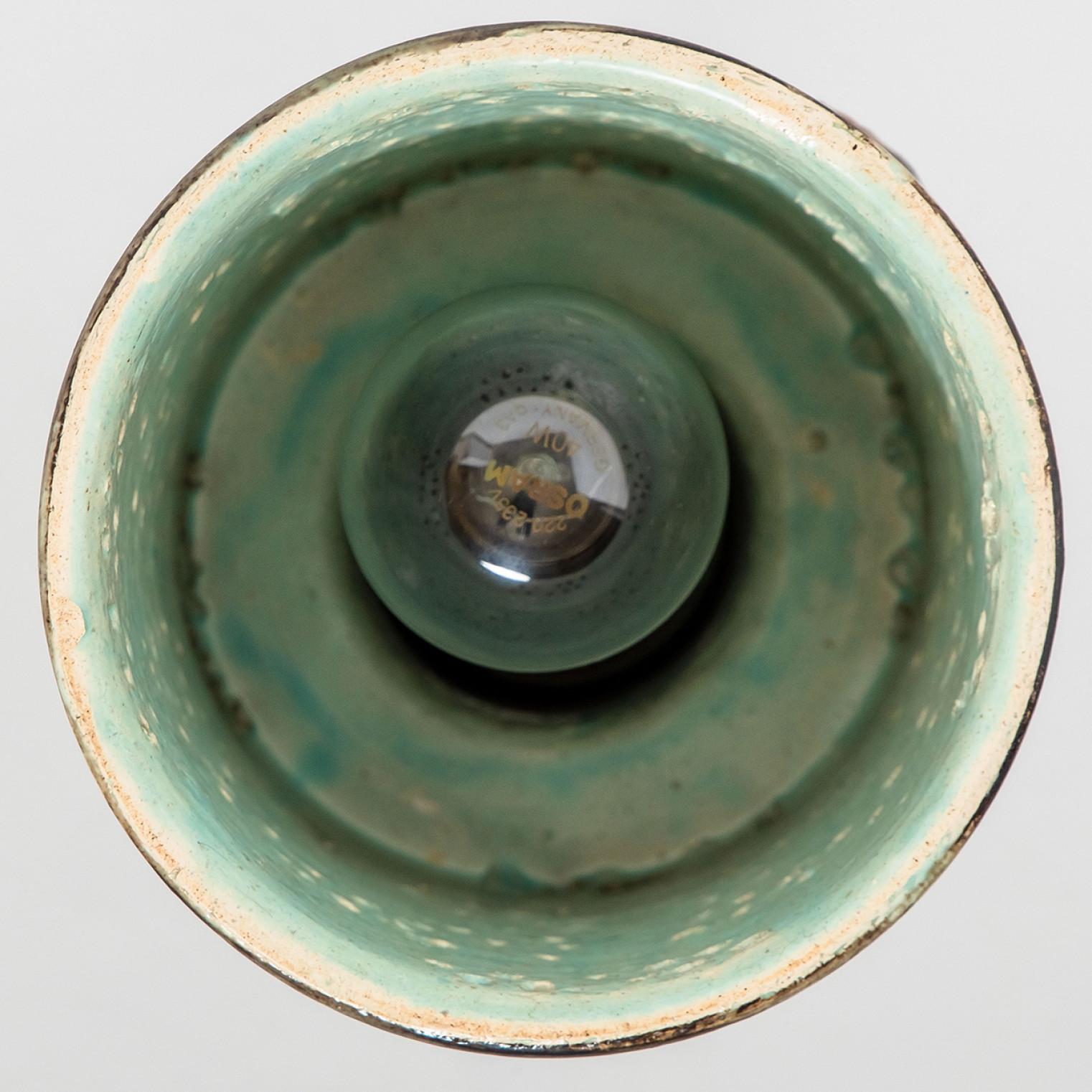 Stunning round hanging lamp with a cone-like shape, made with rich orange and green colored brown ceramics, manufactured in the 1970s in Denmark. We also have a multitude of unique colored ceramic light sets and arrangements, all available in the