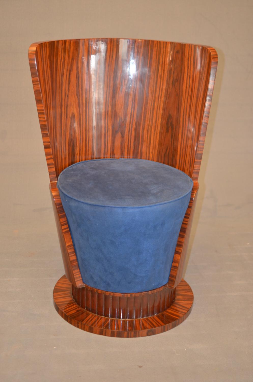 Cylinder armchair in Art Deco style of French origin of 1925 in dark rosewood. The armchair has a high back and a seat in blue velvet.