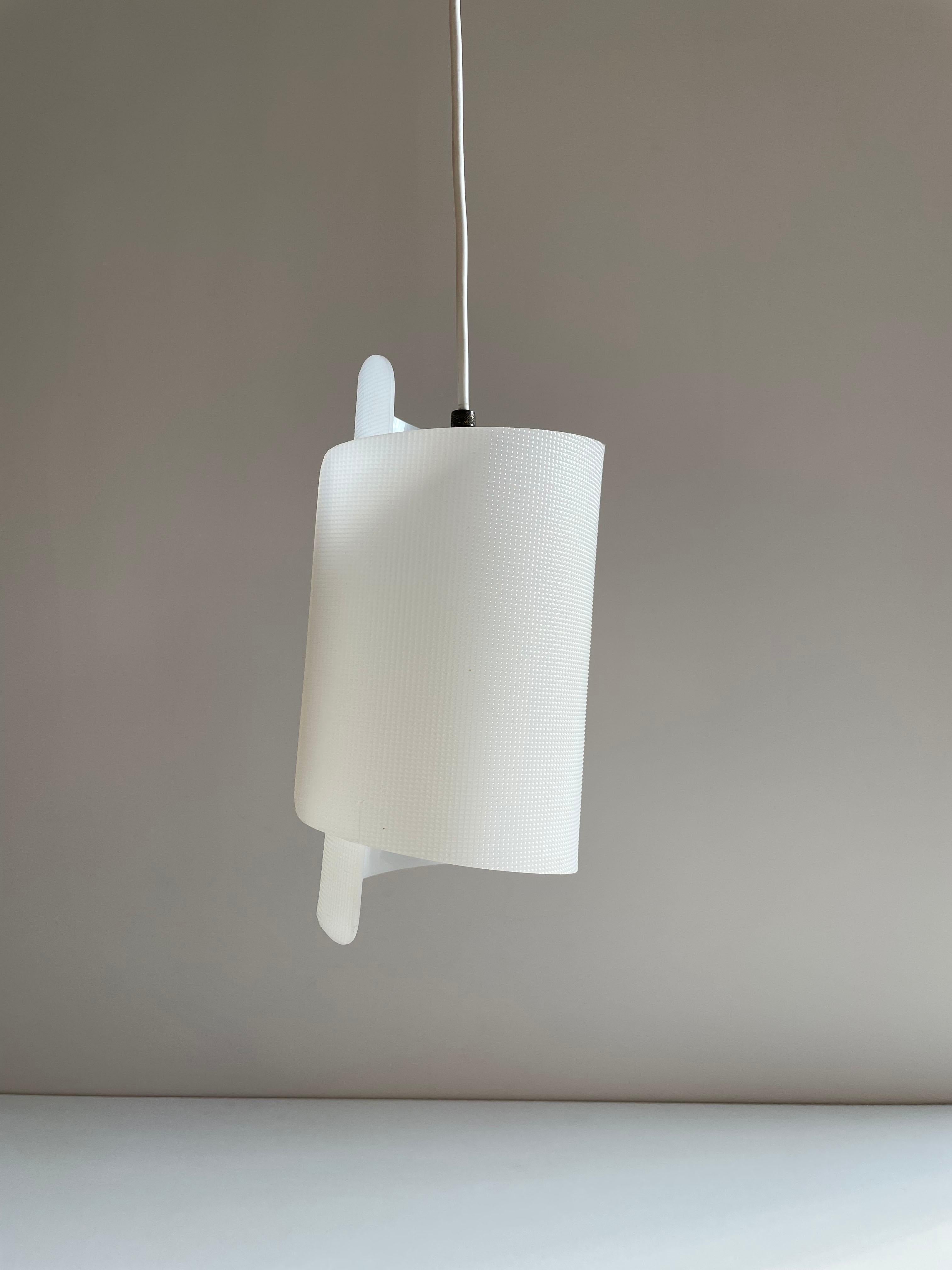 Very stylish small size mid-century pendant lamp attributed to Austrian company Nikoll

The lampshade is made of textured white acrylic, with discrete details in brass

1xE27 lamp socket

Dimensions of the lampshade: 26.5 x 14.5 x 13 cm (H/W/D)
The