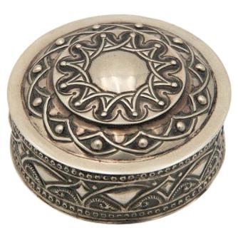 Cylindrical box in embossed silver