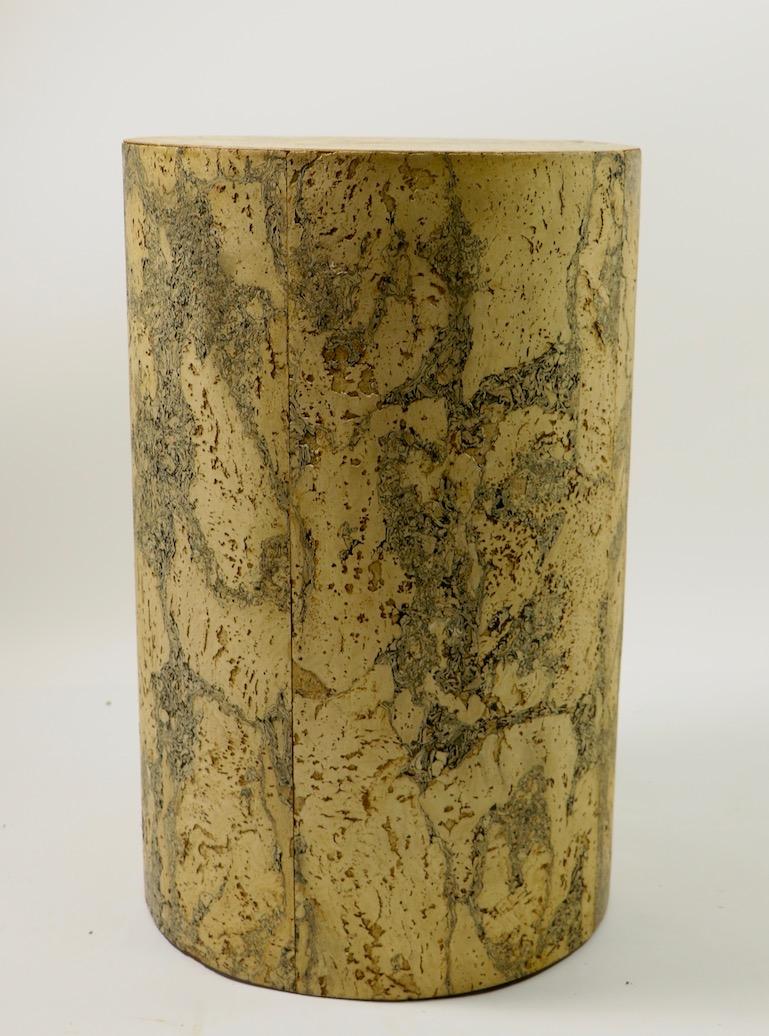Stylish cylindrical pedestal in allover cork veneer, circa 1970s. This example is in good condition, showing minor loss to veneer (see images) and expected cosmetic wear, normal and consistent with age. Perfect to showcase sculpture, and objet d'art.