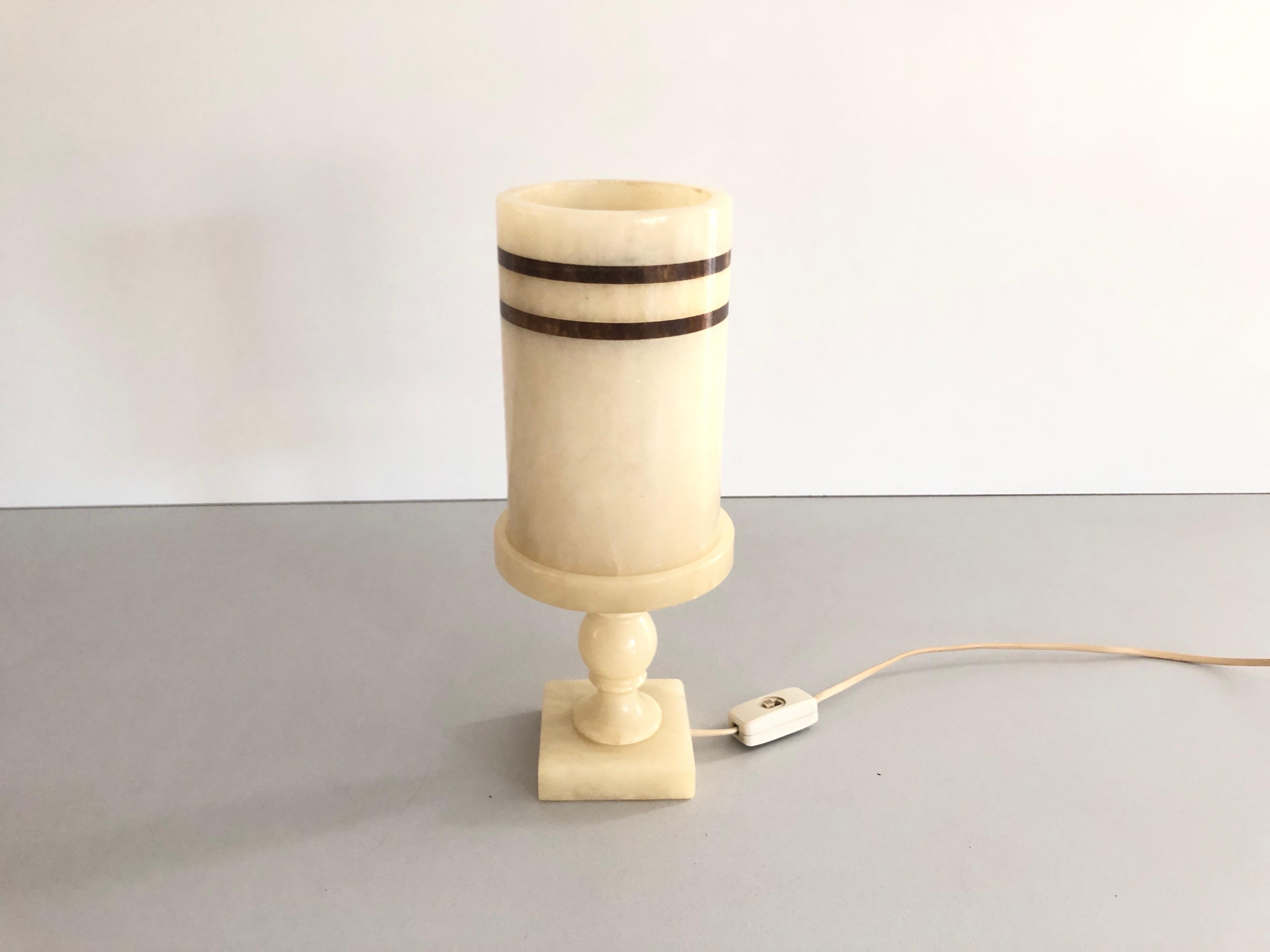 Cylindrical Design Heavy Marble Craft Table Lamp, 1960s, Germany

Lamp is in very good vintage condition.
Weight: 3,2 kg

It has European plug. It can be converted to other countries plugs with using converter. Also it can be rewired different type