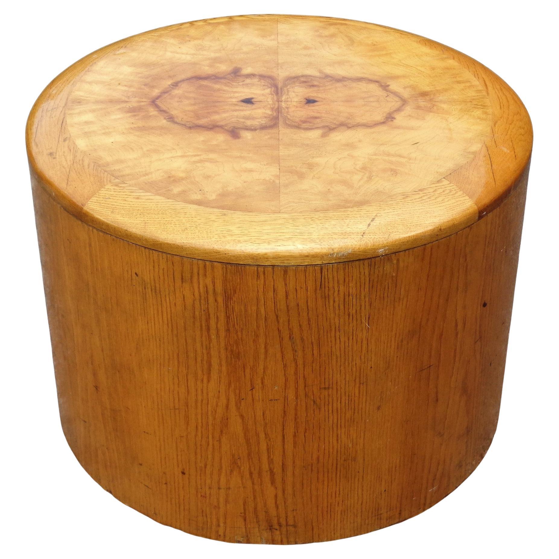 Cylindrical drum table w/ nicely grained oak veneer base and exotic olive wood burl top. Circa 1970's. Great looking. 24